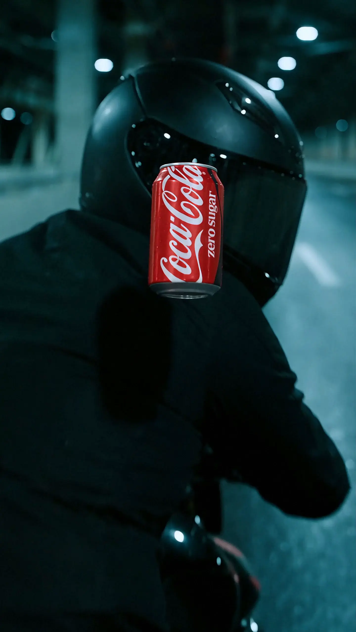Coca-Cola Zero Sugar can moments before colliding with a motorcycle helmet